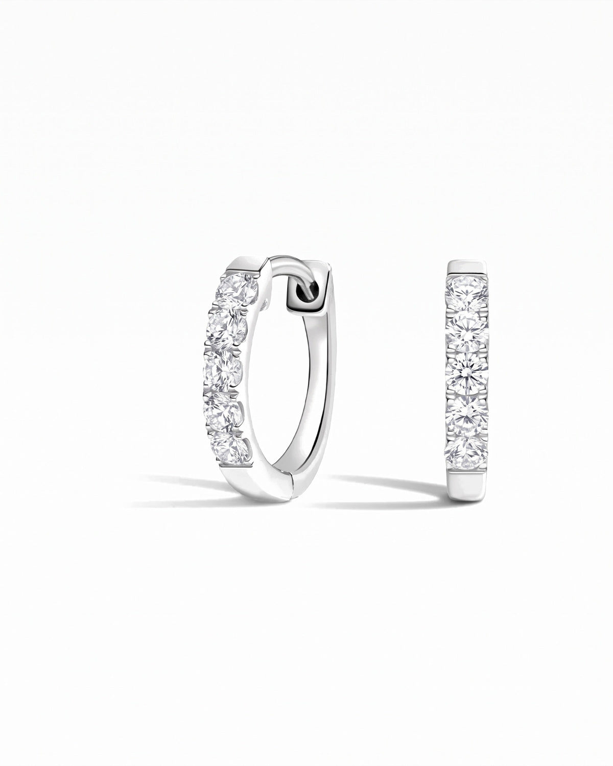 Capri Round White Sapphire Huggie Earrings - Image 1