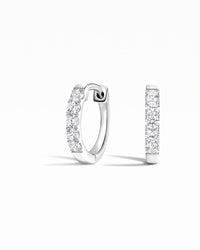 Capri Round White Sapphire Huggie Earrings - Image 1