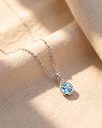 Mayfair Aquamarine Twist Pendant on linen