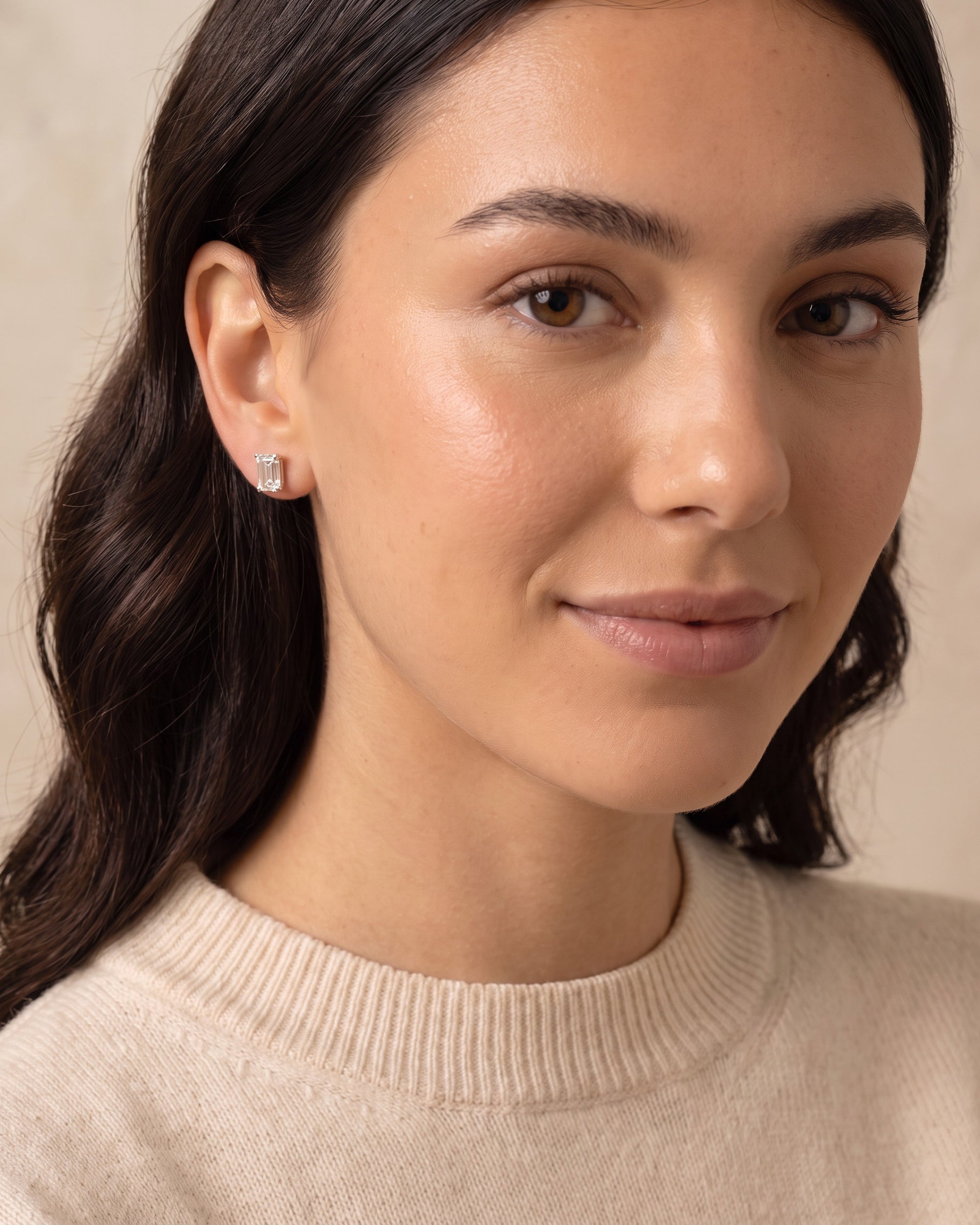 Louvre Emerald Cut White Sapphire Stud Earrings worn by model, front view